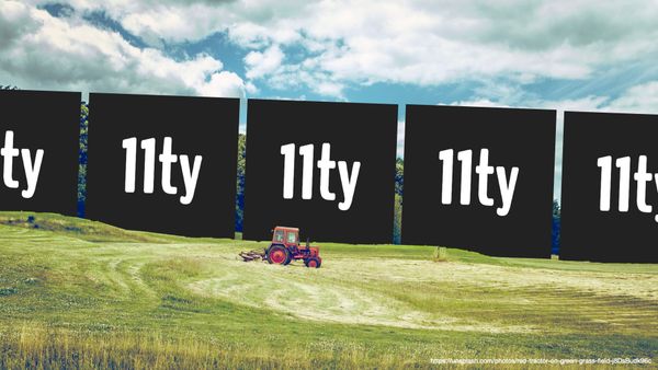 The 11ty logo sits in a field landscape with a small red tractor in the middle